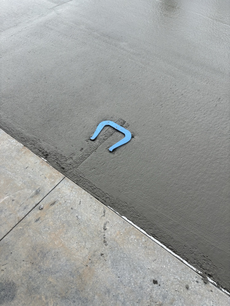 horseshoe in concrete