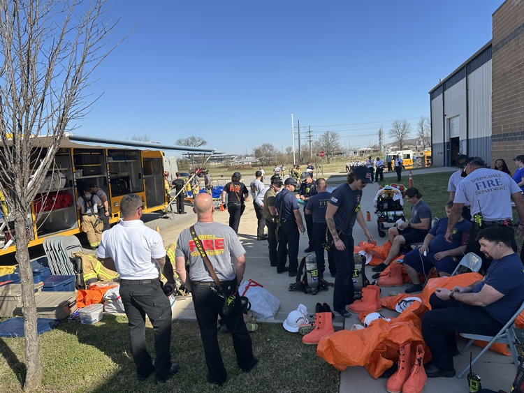 firefighters getting into Hazmat suits