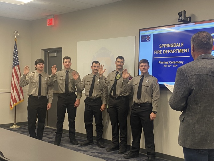 Firefighter being sworn in by the mayor