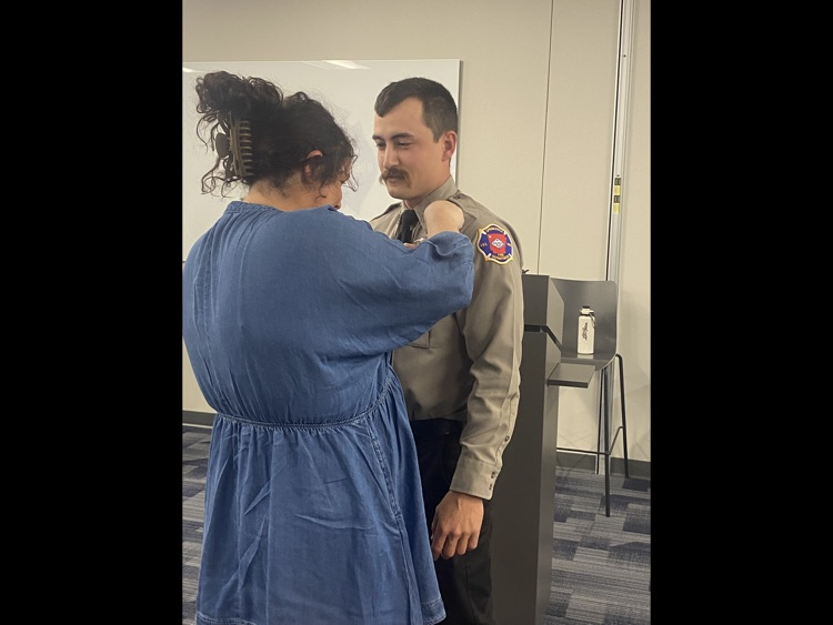 firefighter being pinned by his wife