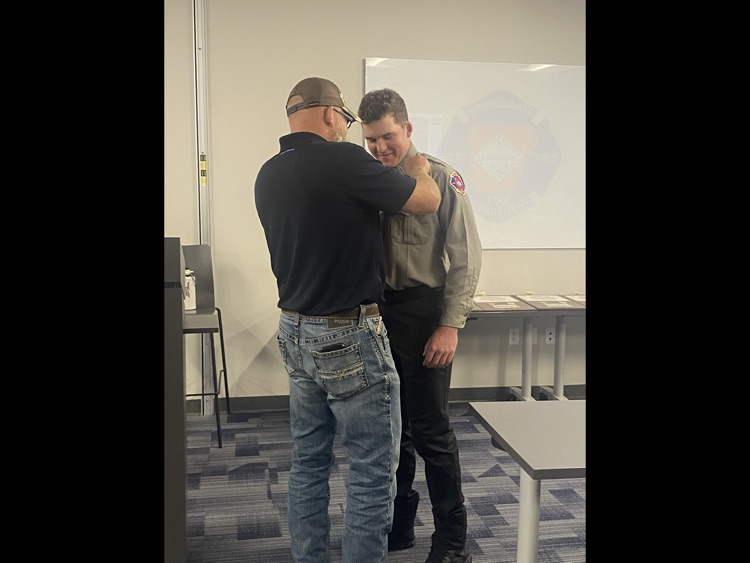 firefighter being pinned by his father