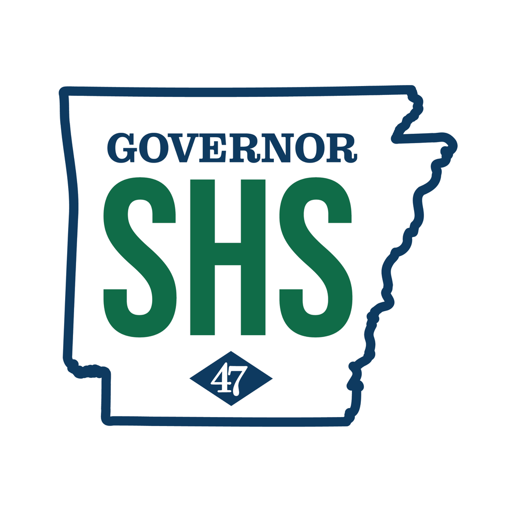 Graphic on a white background featuring a navy blue outline of the state of Arkansas. Inside the outline, the word “GOVERNOR” appears in large navy blue letters above the initials “SHS” in bold green lettering. Near the bottom is a navy blue diamond containing the number “47” in white, representing Arkansas’ 47th governor.