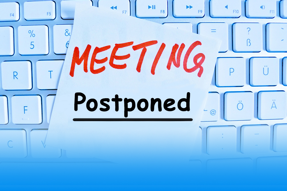Meeting Postponed post-it on a keyboard