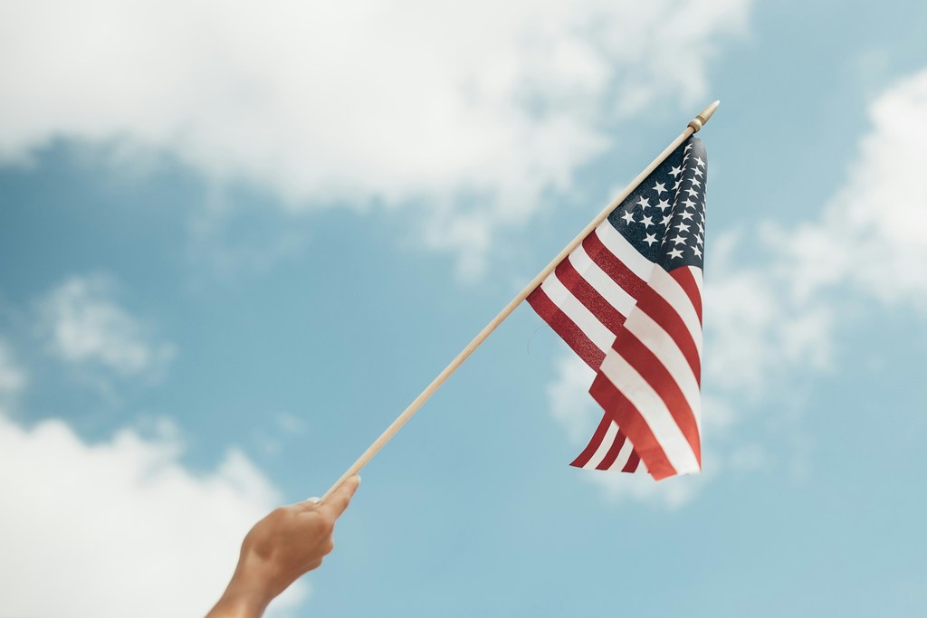 American flag flying in the air.