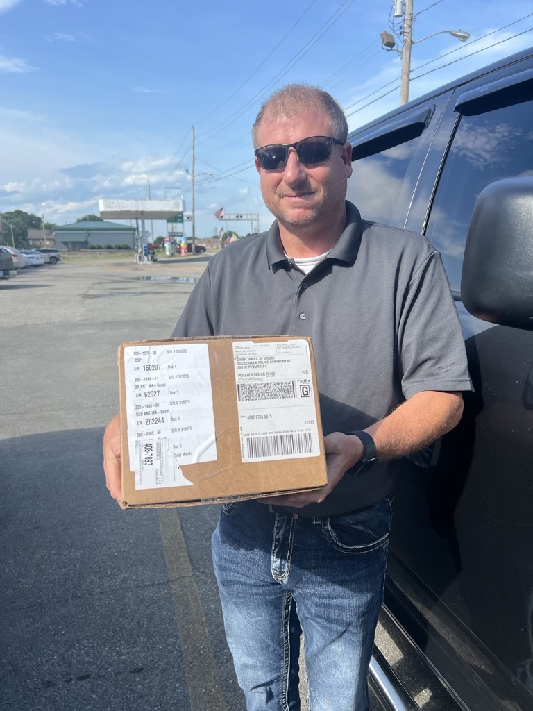 Chief James Moody holding donated radar 