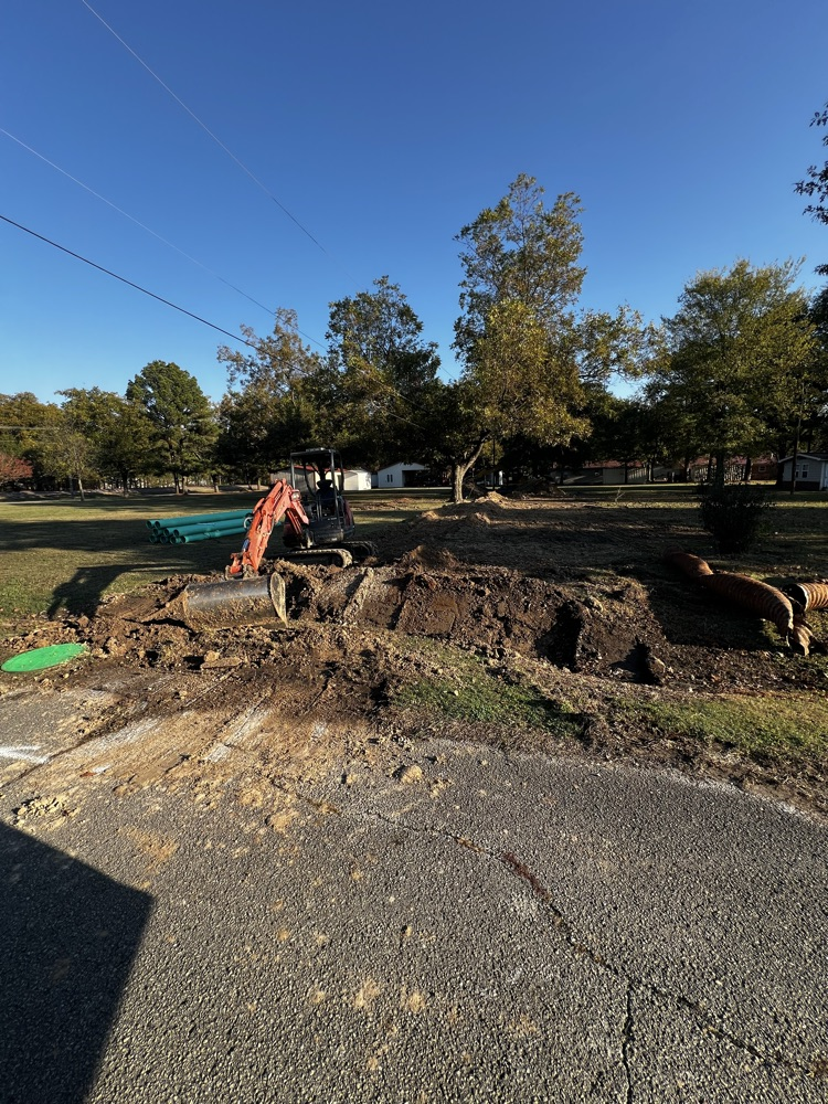 image of work being done on sewer line in town 