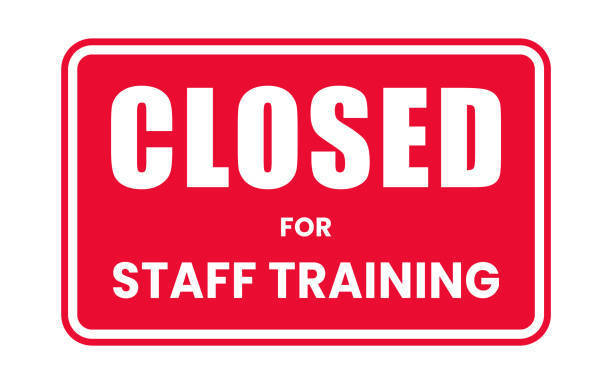 red sign that says closed for staff training