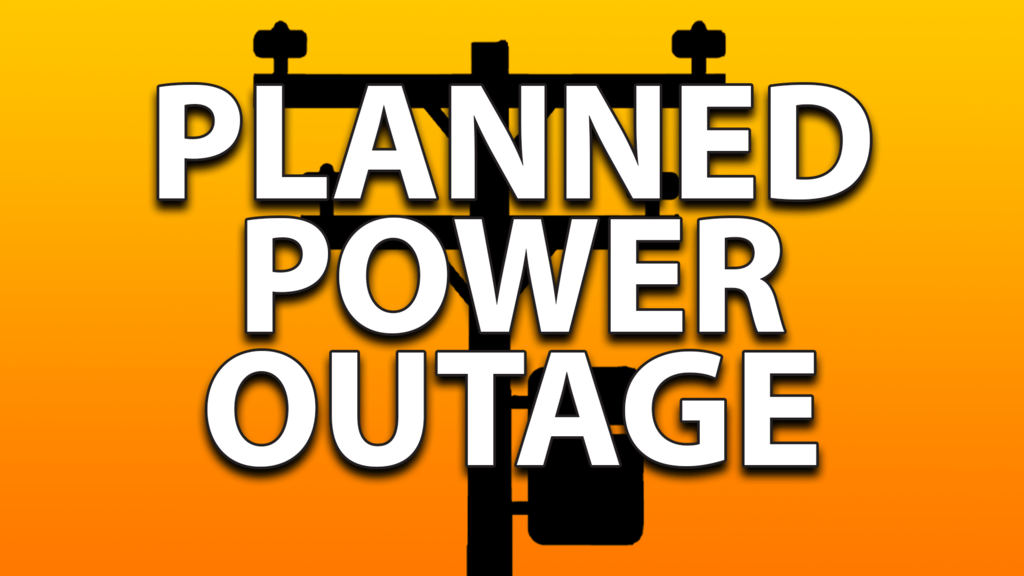 yellow to orange shades with a black utility pole in the background with PLANNED POWER OUTAGE in white