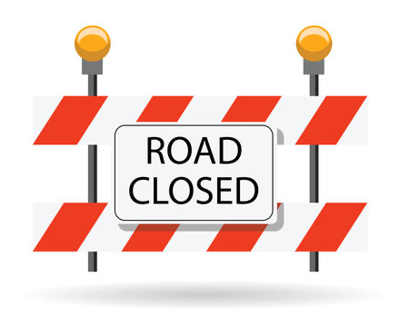 road closed sign on a white and orange stripes and yellow lights 