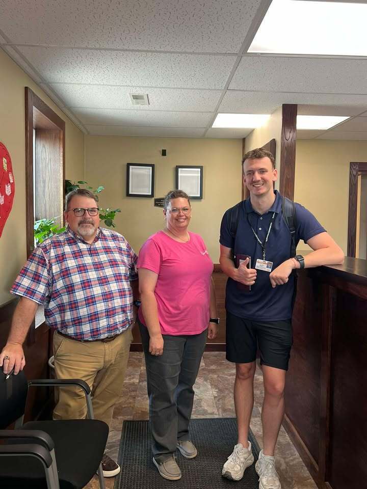 Darren Berry, Brandie Gay and Povilas standing in the front entry way of the Vandalia City Hall