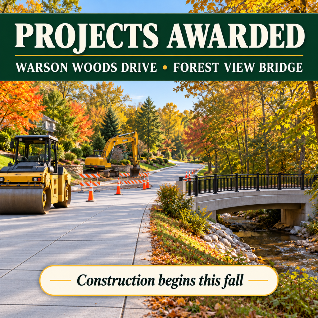 a street with a backhoe and street roller and a bridge on the right.