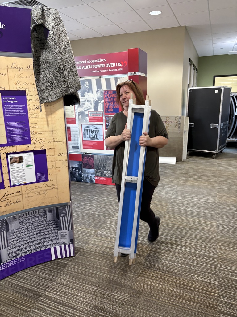 Library staff and volunteers worked hard Wednesday morning to setup the Smithsonian Traveling Exhibit