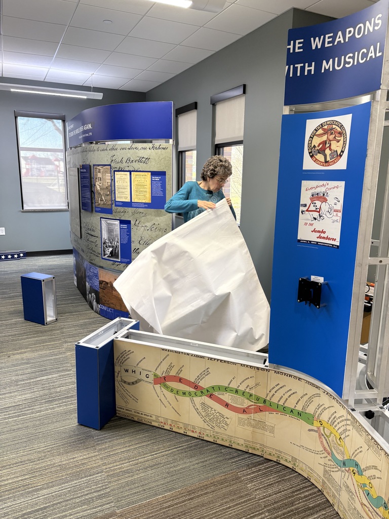 Library staff and volunteers worked hard Wednesday morning to setup the Smithsonian Traveling Exhibit