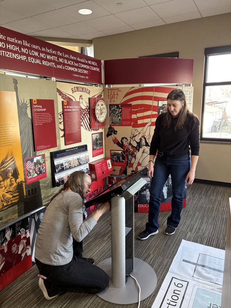Library staff and volunteers worked hard Wednesday morning to setup the Smithsonian Traveling Exhibit