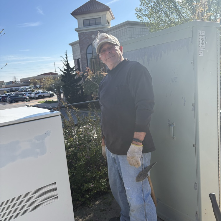 VIPs beautifying the library grounds