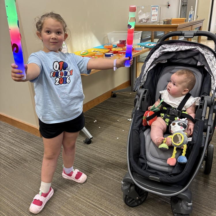 child wielding a lightsaber
