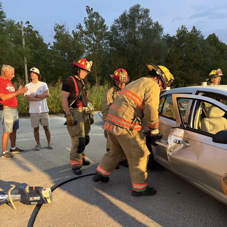 firefighters using tools for vehicle extrication training