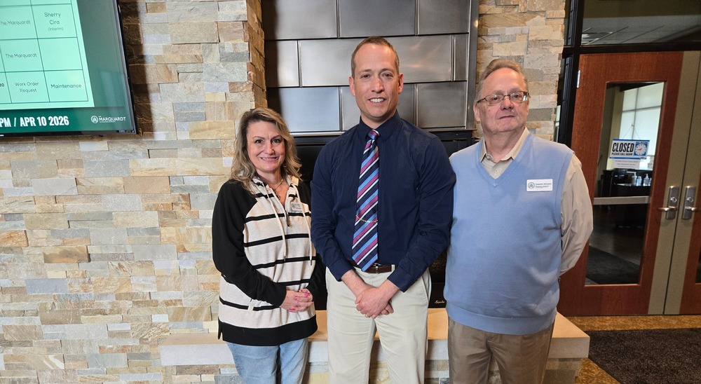 Mayor Stocks standing with Marquart personnel