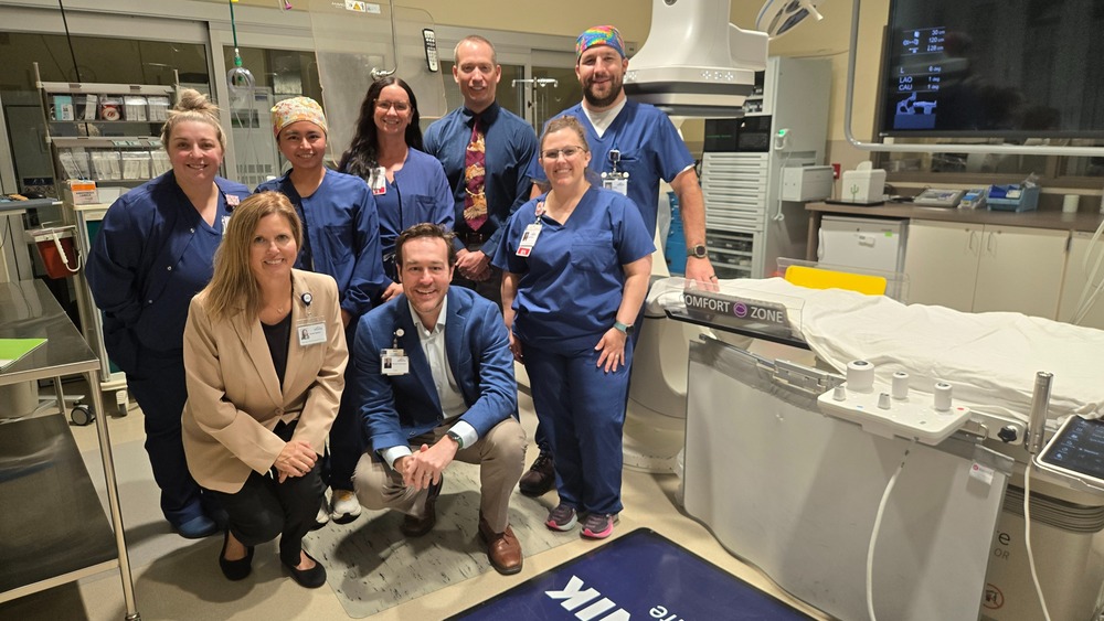 A group of people standing in a medical imaging room