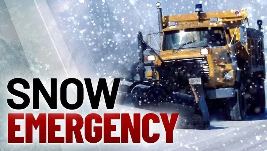 Snow plow and the words "snow emergency "