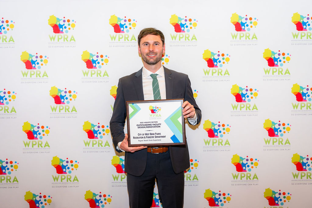 Picture of Ryan Schmidt holding an award