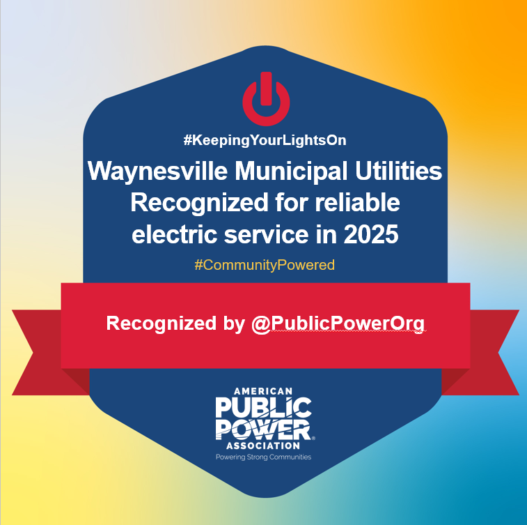 Graphic with a blue badge on a gradient background (yellow, orange, and teal) featuring a red power symbol at the top. Text reads: “#KeepingYourLightsOn. Waynesville Municipal Utilities Recognized for reliable electric service in 2025. #CommunityPowered.” A red banner across the badge states: “Recognized by @PublicPowerOrg.” At the bottom is the American Public Power Association logo with the tagline “Powering Strong Communities.”