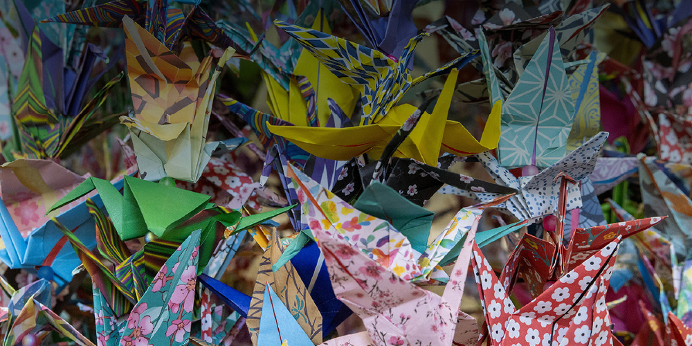 A close up of a bunch of origami cranes