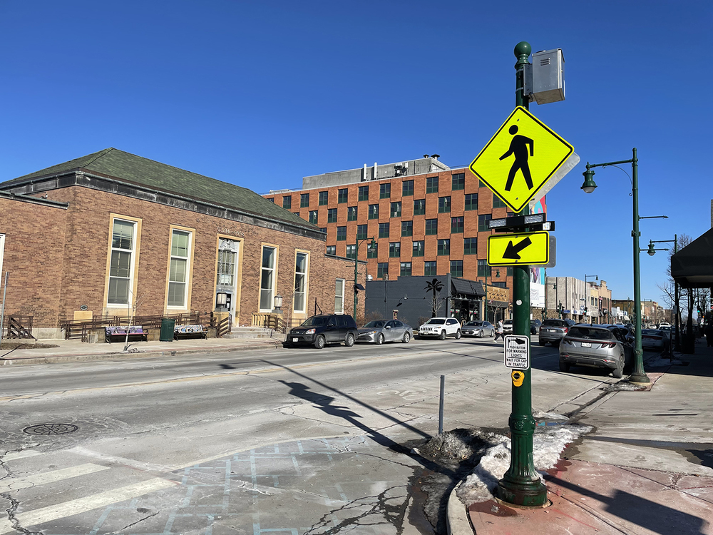 Photo of the intersection at 75th and Greenfield Ave showing the flashing beacon for pedestrians