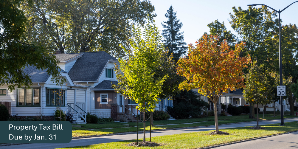A photo of homes on a West Allis street. Text reads "Property Tax Bill Due by Jan. 31"