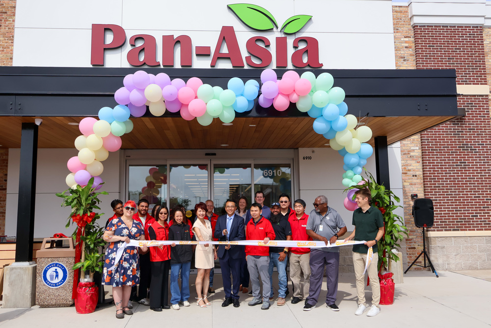City Officials pose with Pan-Asia officials for a ribbon cutting