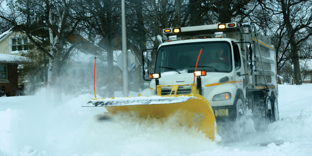 A photo of a West Allis snow plow pushing snow.