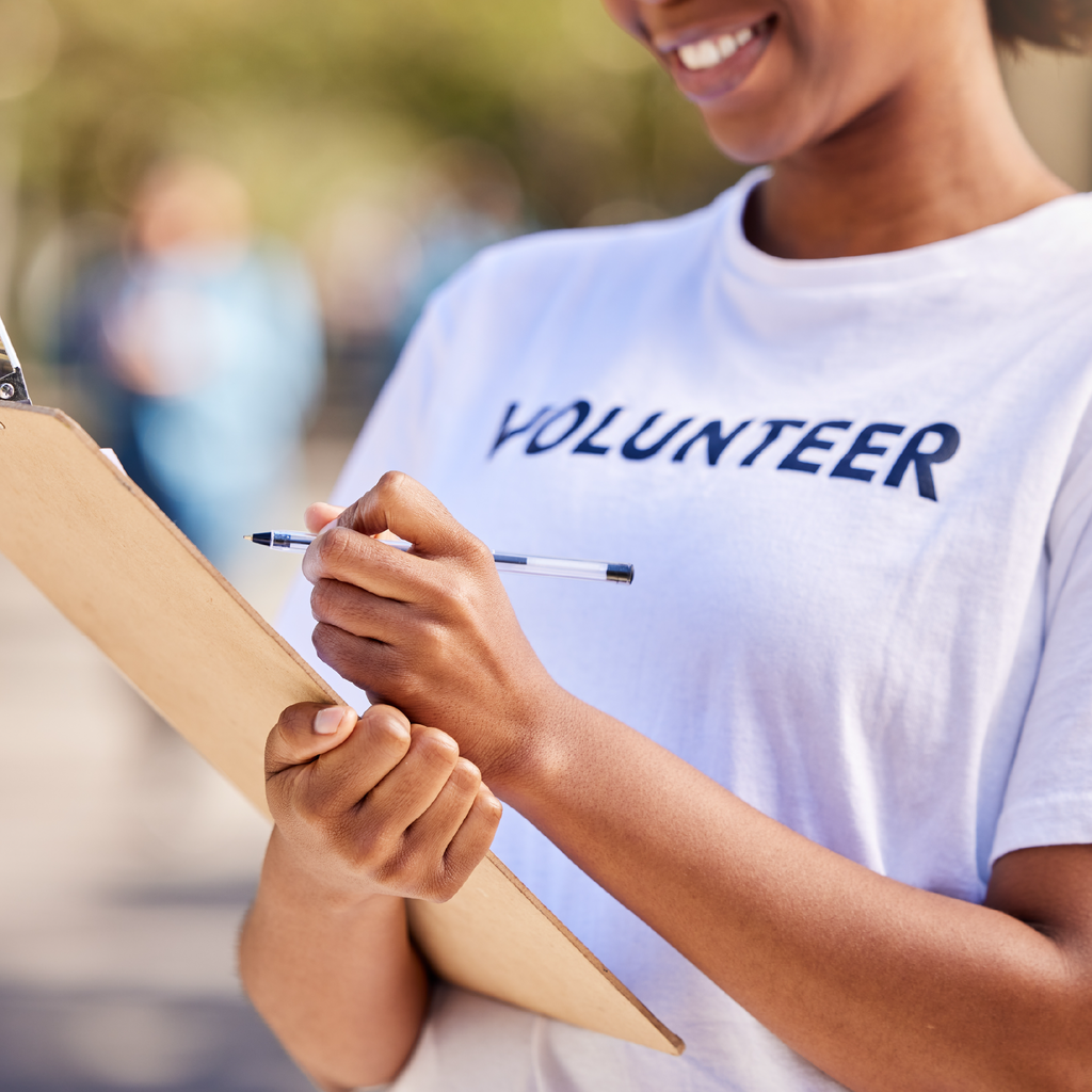 A volunteer holding a clipboard