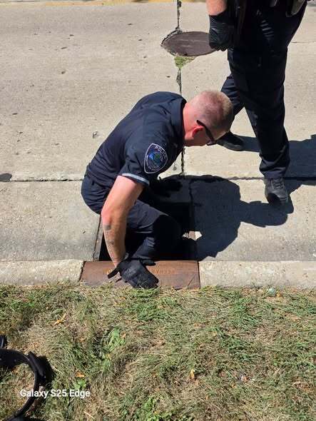 Whitewater PD rescuing the ducklings inside a storm drain!