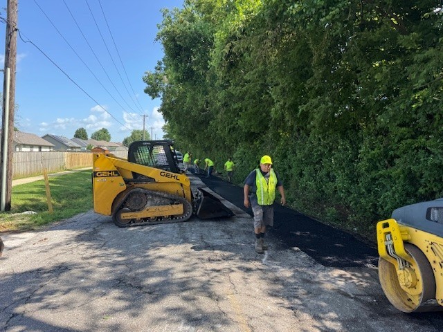 Images of public works staff working on repairs to South Hunt Road
