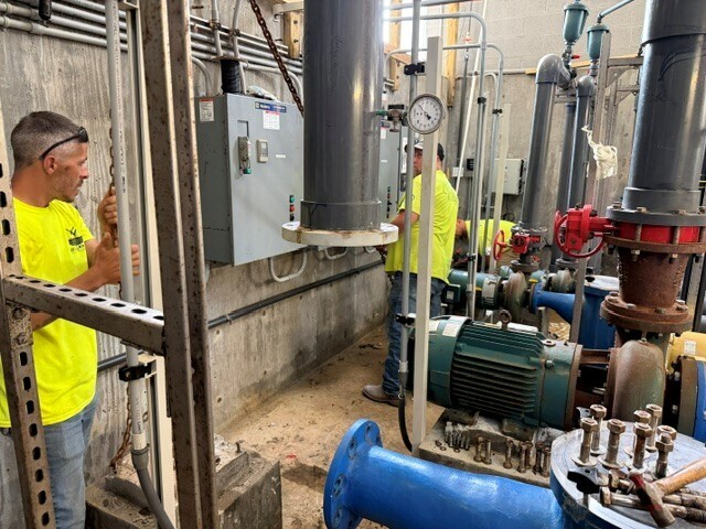 Parks Employees Working on Pool Pump