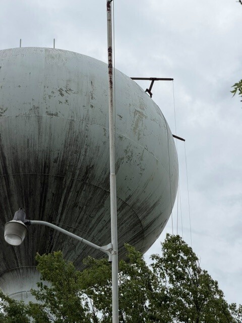 A close up of the work lines hanging from the top of the tower