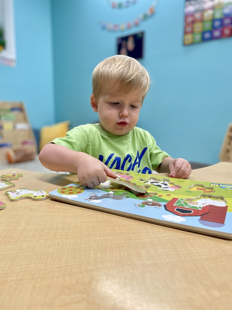 toddler with puzzle