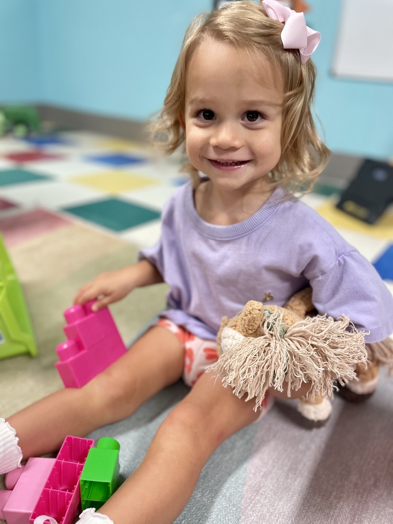 happy girl playing with blocks