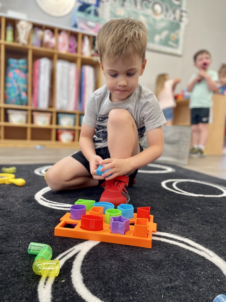 little boy playing with blocks