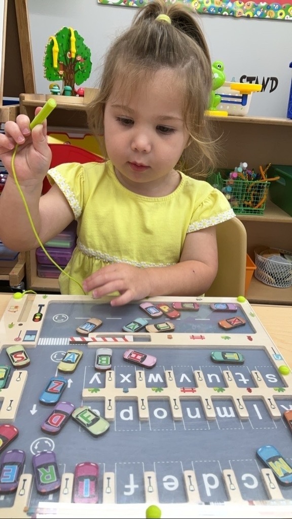 Little girl with puzzle
