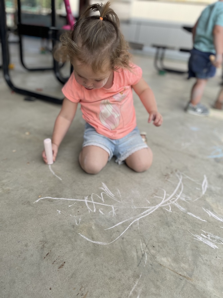 little girl with chalk