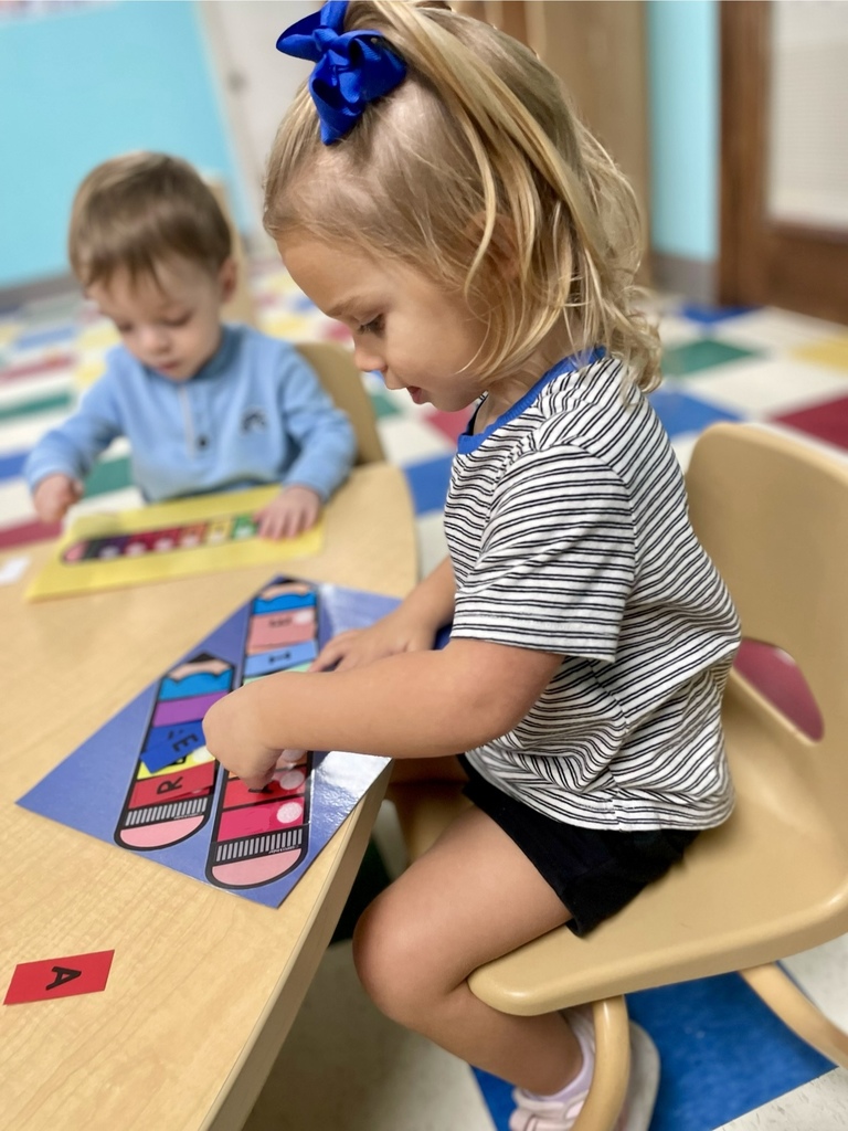 Girl working on table toys