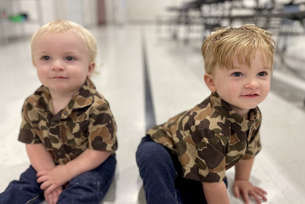 2 twin boys in camp shirts