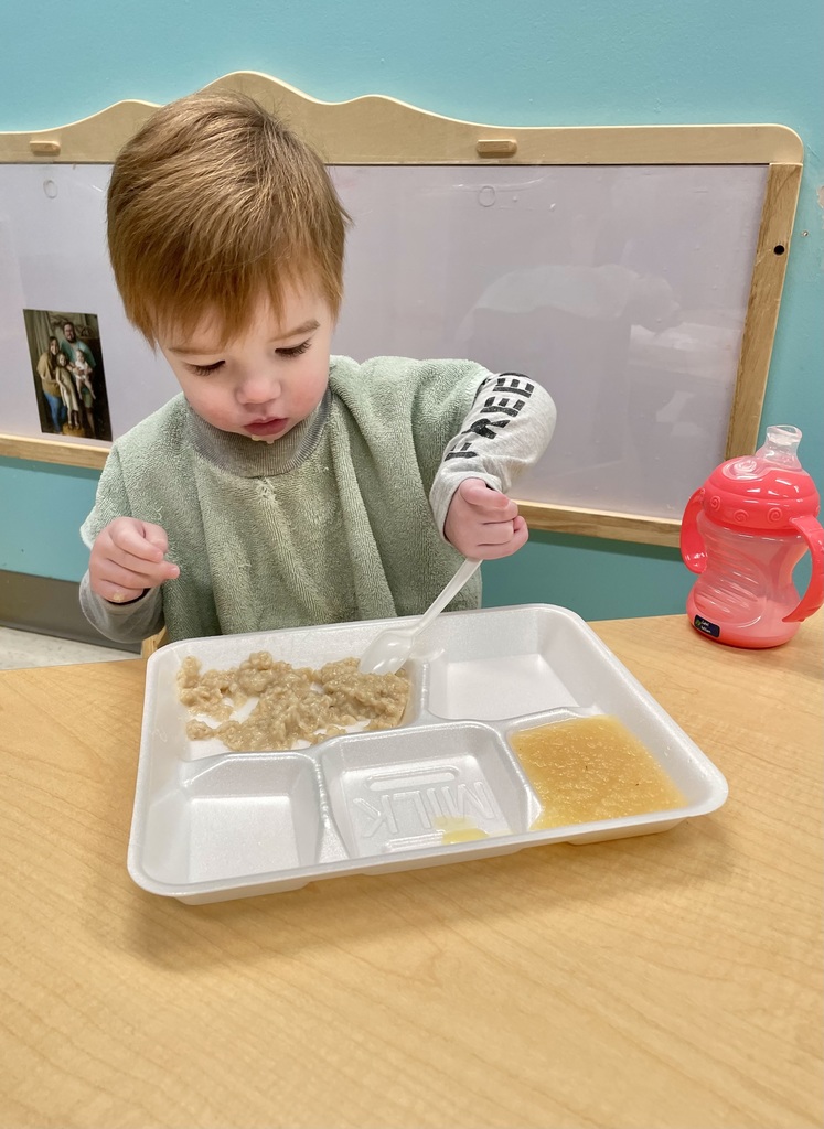 toddler using a spoon
