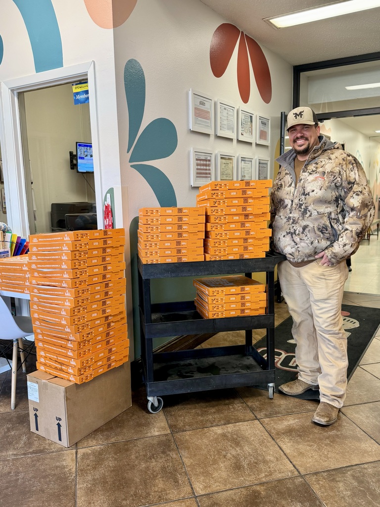 Dad with boxes of pizza