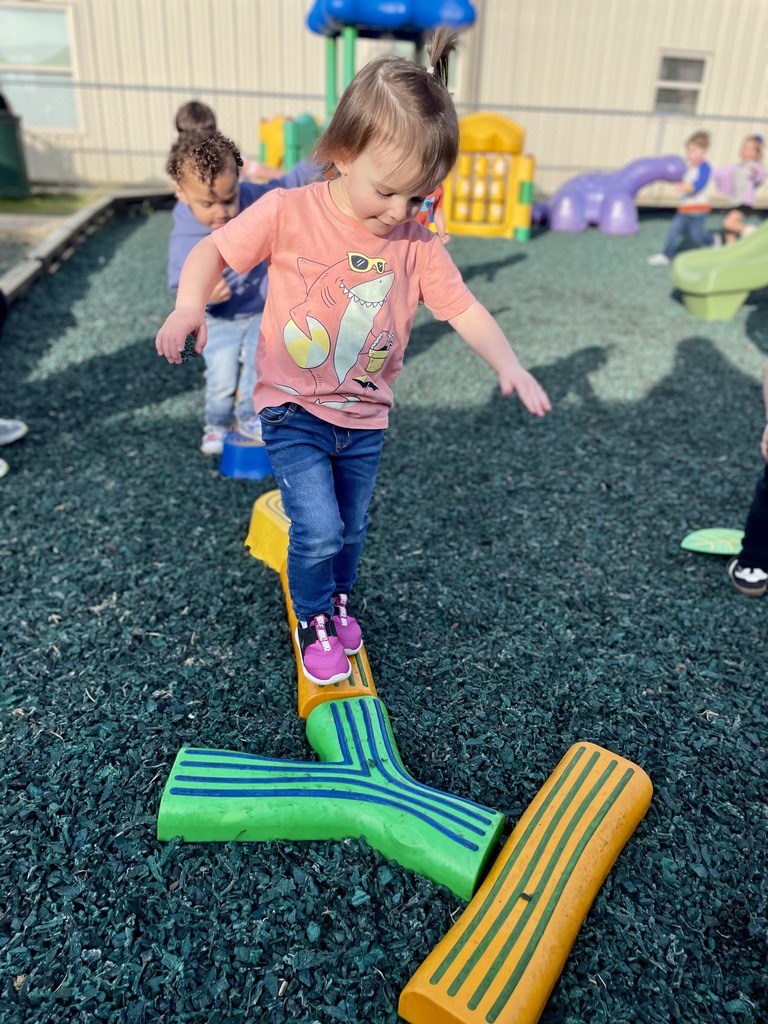 students on balance beams