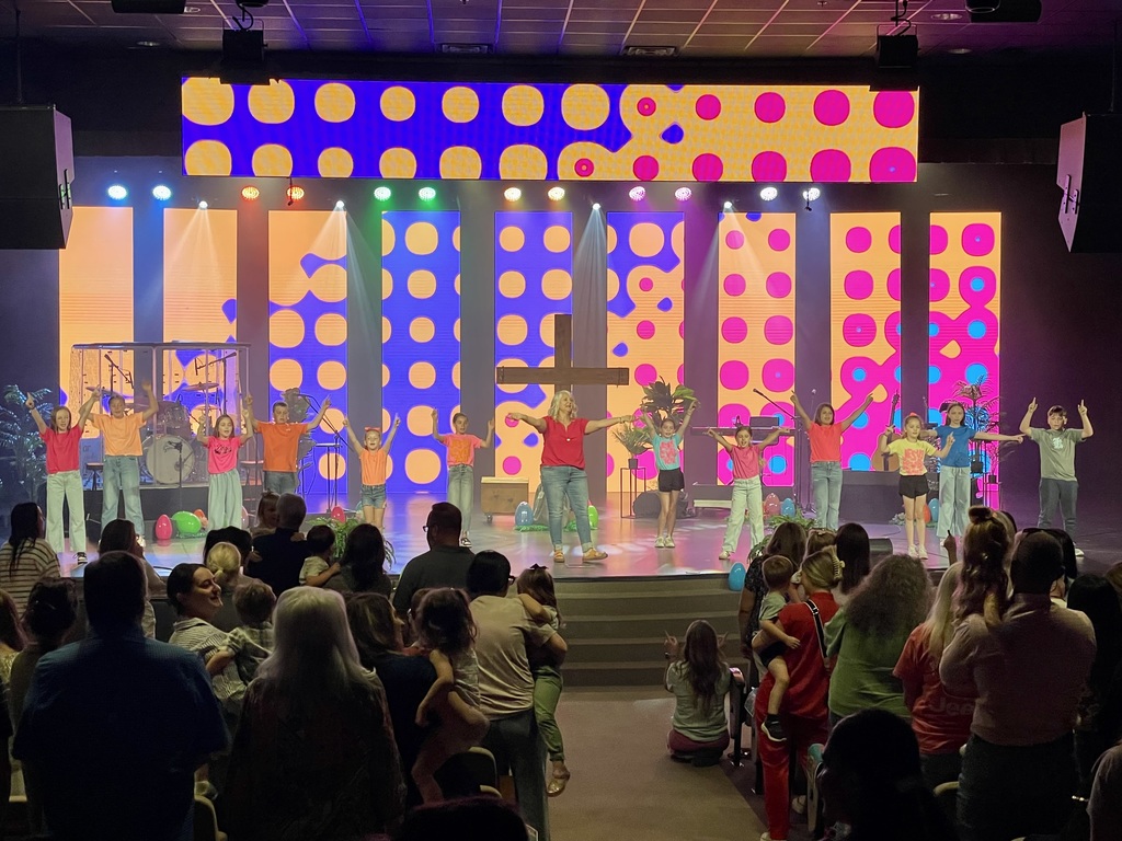 Mrs. Flo leading worship songs through movement