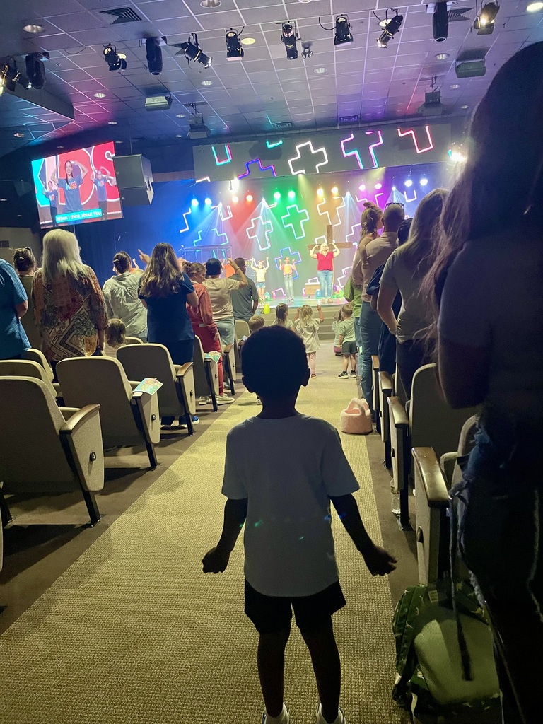 Little boy participating during worship songs