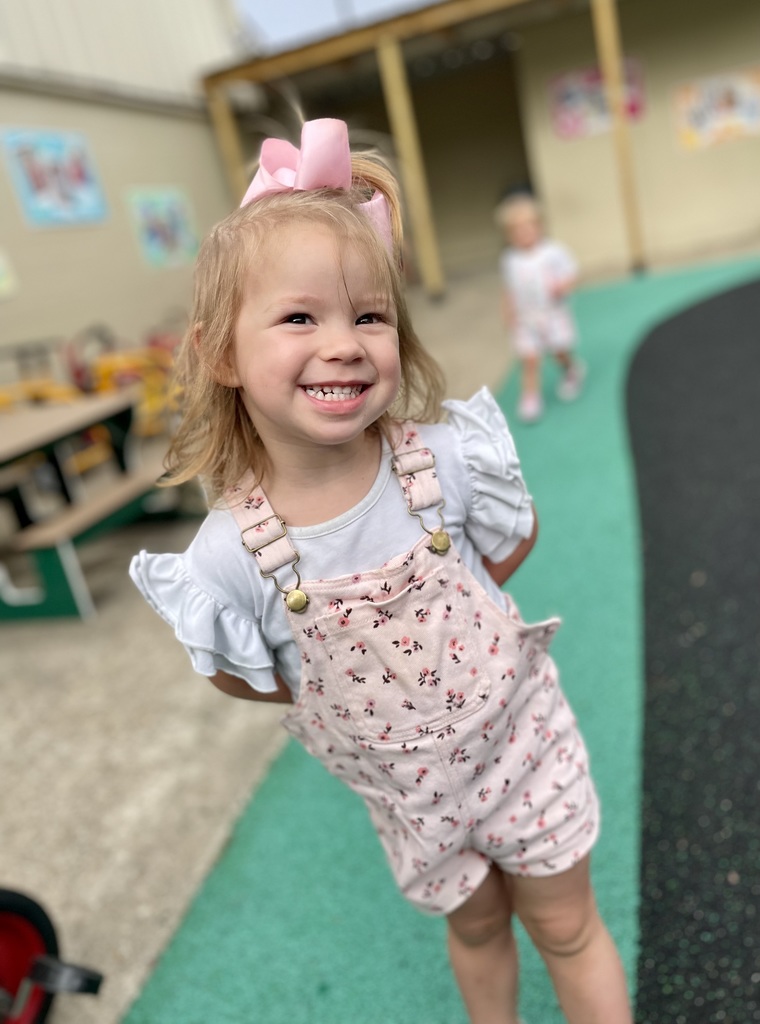 toddler girl with overalls