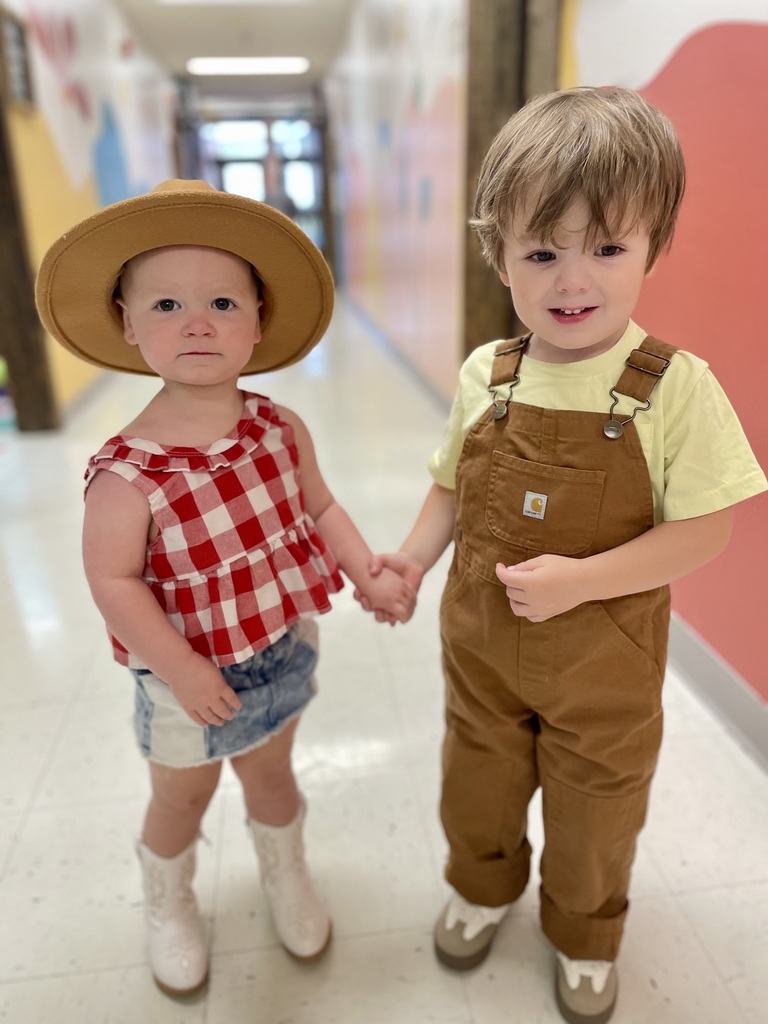 2 kids dressed up like farmers